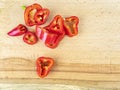 Red pepper sliced on a wooden cutting board Royalty Free Stock Photo