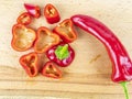 Red pepper sliced on a wooden cutting board Royalty Free Stock Photo