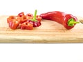 Red pepper sliced on a wooden cutting board Royalty Free Stock Photo