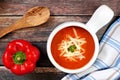 Red pepper soup overhead scene on rustic wood background Royalty Free Stock Photo