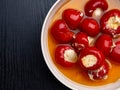 delicious italian appetizer, red bell peppers filled with a cream of cheese and herbs, copy space, top view Royalty Free Stock Photo