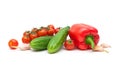 Red peppers, garlic, cherry tomatoes and cucumbers on a white b Royalty Free Stock Photo