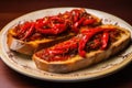 Red peppers with great anchovies on a slice of bread. Typical Spanish food