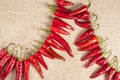 Red chilli Peppers on vintage fabric Royalty Free Stock Photo