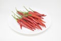 Red peppers on a white plate On a white background Royalty Free Stock Photo