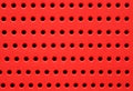 Red perforated plastic background Royalty Free Stock Photo