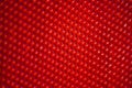Closeup of red round-holed metal fence Royalty Free Stock Photo