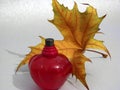 Red perfume and yellow lamina Royalty Free Stock Photo