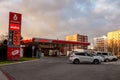 The red petrol station of local Benzina company in Ostrava during cloudy sunset