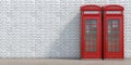 Red phone booth on brick wall background. London, british and english symbol Royalty Free Stock Photo