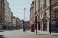 Red phone booth on empty Haymarket, London, UK