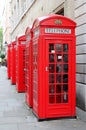 Red phone box telephone booth british in London uk Royalty Free Stock Photo