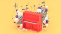 The red piano is surrounded by notes and colorful balls on the orange background