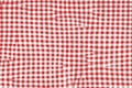 Red picnic blanket fabric with squared patterns and texture