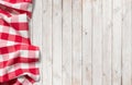 Red picnic cloth on white wood table