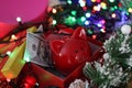 Red piggy bank with dollars lying in gift box among New Year`s decorations Royalty Free Stock Photo