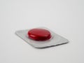 Red pill on a white background. Sealed red pill. Royalty Free Stock Photo