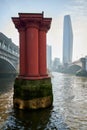 red pillars or columns from original Blackfriars railway bridge in river thames, london on hazy sunny day in winter with One Royalty Free Stock Photo