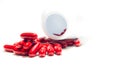 Red pills and pill bottle Royalty Free Stock Photo