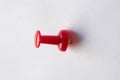 Red pin attached on a white, empty paper Royalty Free Stock Photo