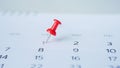 Red pin marking on calendar Royalty Free Stock Photo