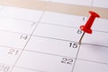 Red pin marking the 15th on a calendar Royalty Free Stock Photo