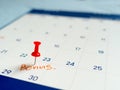 Red pin push on day 30 of end month on white calendar. Mark this day as bonus date Royalty Free Stock Photo