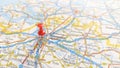 A red pin stuck in Antwerp on a map of Belgium