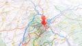 A red pin stuck in Clermont Ferrand on a map of France