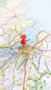 A red pin stuck in Edinburgh on a map of Scotland portrait Royalty Free Stock Photo