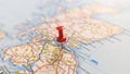 A Red pin stuck in Edinburgh on a map of Scotland Royalty Free Stock Photo