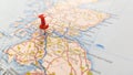 A Red pin stuck in Glasgow on a map of Scotland Royalty Free Stock Photo