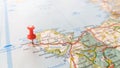 A red pin stuck in Holyhead Anglesey on a map of North Wales Royalty Free Stock Photo