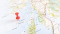 A red pin stuck in the island of colonsay on a map of Scotland Royalty Free Stock Photo