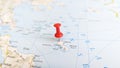 A red pin stuck in the island of skyros skiros on a map of Greece Royalty Free Stock Photo