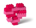 Red pink color 3d heart breaking, made of toy building blocks