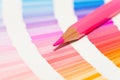 Red and pink colored pencils and color chart of all colors Royalty Free Stock Photo