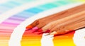 Red and pink colored pencils and color chart Royalty Free Stock Photo