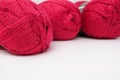 Red pink colorful skeins of yarn close up, fuchsia color woolen yarn for crochet and knitting, hobby and handmade concept, copu Royalty Free Stock Photo