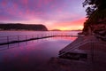 Red and pink dawn skies and reflections in the rock pool