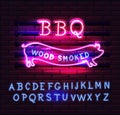 Red and Pink Neon BBQ Pig sign on a brick background . BBQ of Neon-Style. Royalty Free Stock Photo