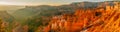 Red-pink-orange rock formation, Bryce canyon sunrise, panoramic view Royalty Free Stock Photo