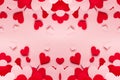 Red and pink paper hearts different size on pink background. Valentine day backdrop.