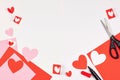 Red and pink paper hearts on white background. Valentine`s day, love, wedding concept Royalty Free Stock Photo