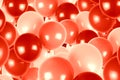 Red and pink party balloons background.