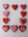 Red and pink sparkly hearts on a white background for valentine's day