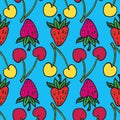 Red and pink strawberries, yellow and red cherry on bright blue background Royalty Free Stock Photo