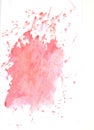 Red and pink watercolor paint stains on white papper