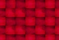 Red and pink wavy textured squares form a seamless geometric pattern creating a bold modern abstract background with layered depth Royalty Free Stock Photo