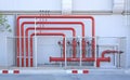 Red pipe of Fire Fighting systems in industrial zone in iron mesh fence. Water station in factory area zone